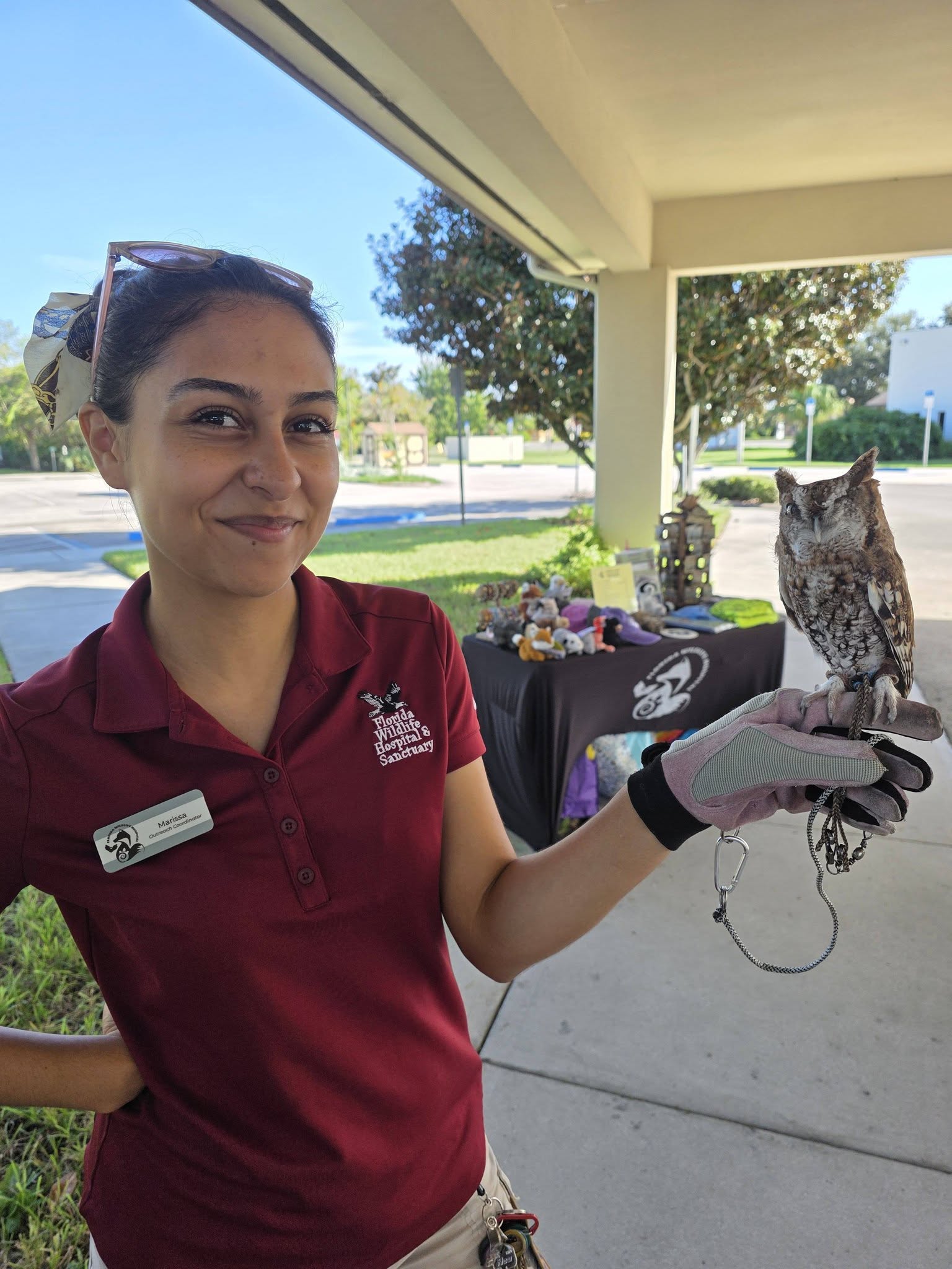 fwh representative holding a small owl